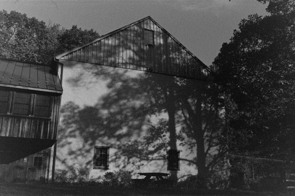 Shadows on a barn wall in crunchy black and white